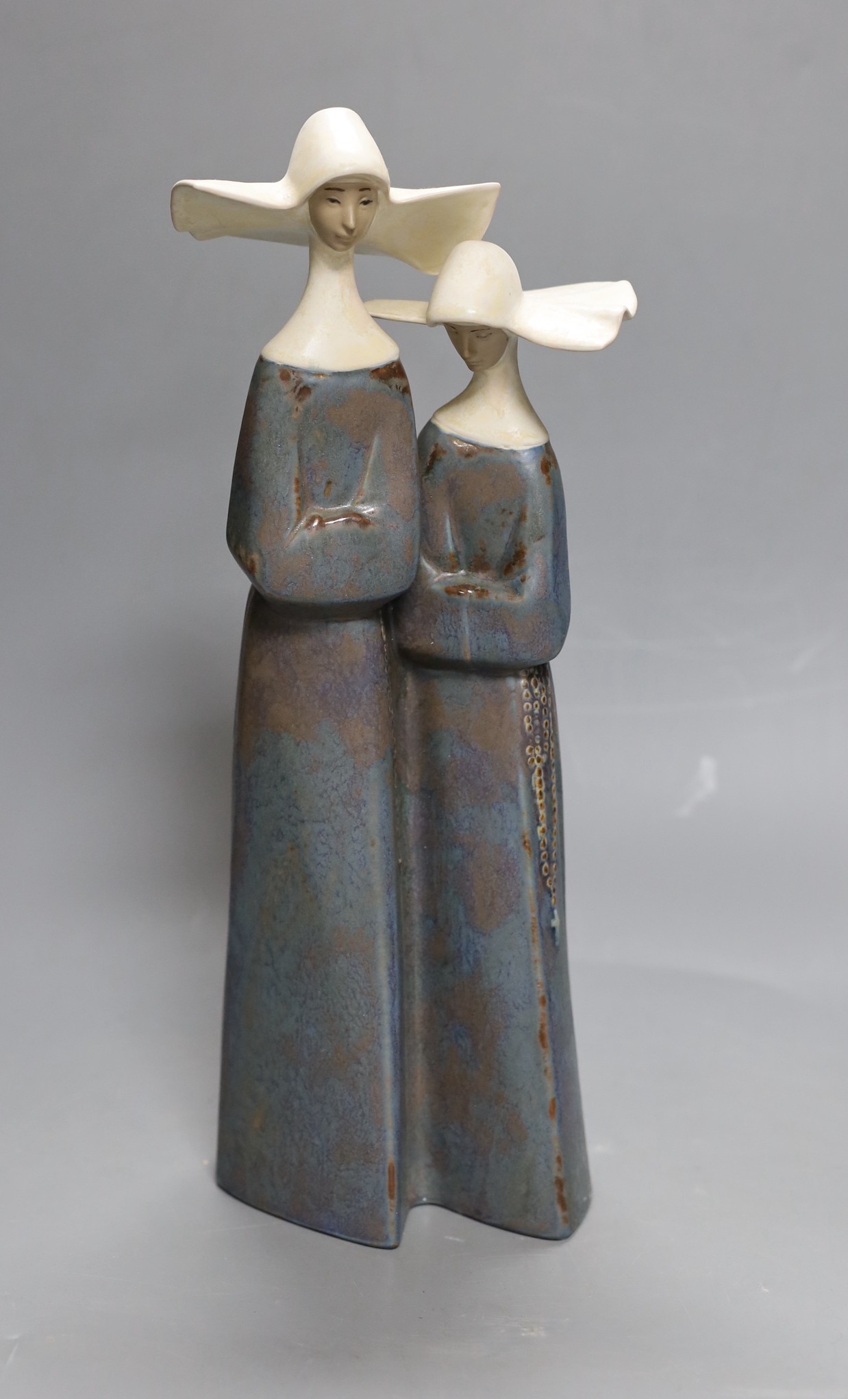 A Lladro stoneware group of two nuns, 34 cm high, boxed